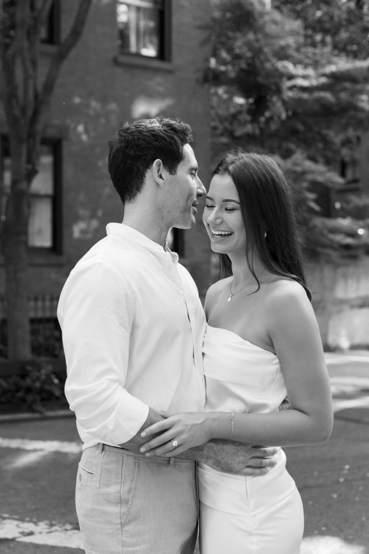 Leah laughing in Jarryd's arms, black and white
