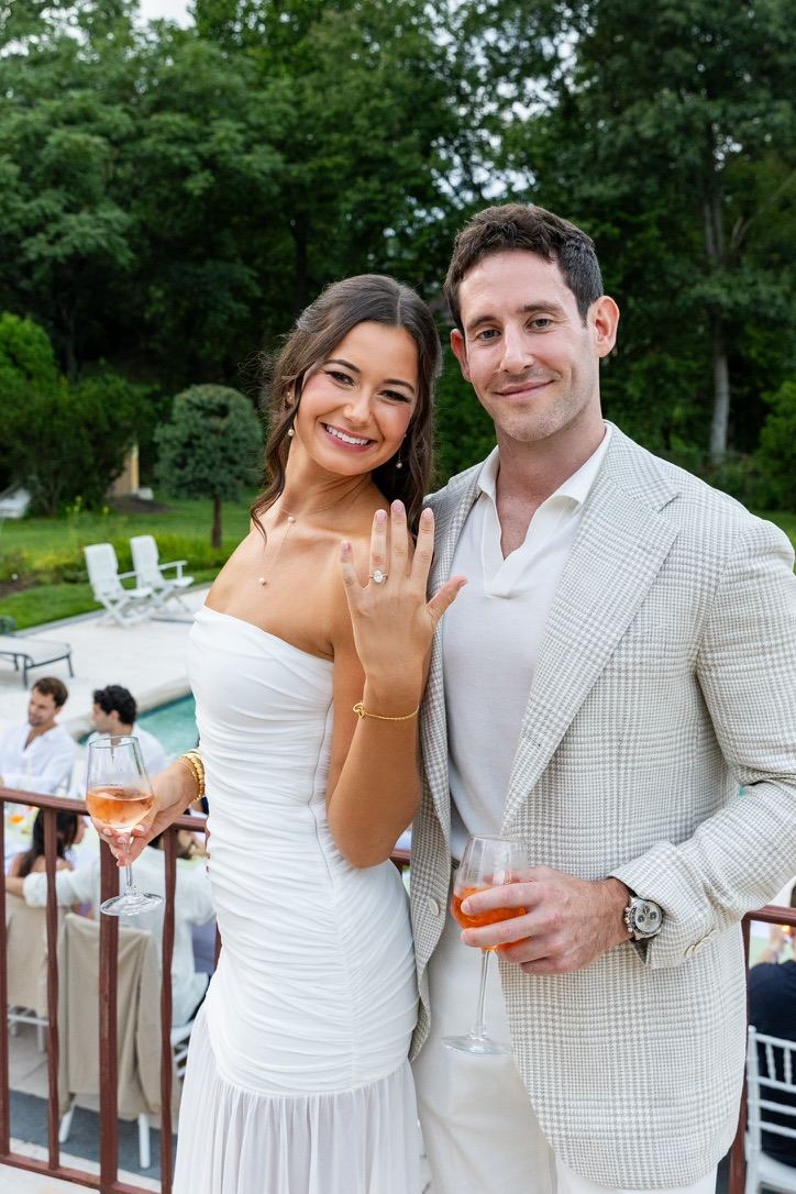 Leah showing her ring beside Jarryd at the engagement party